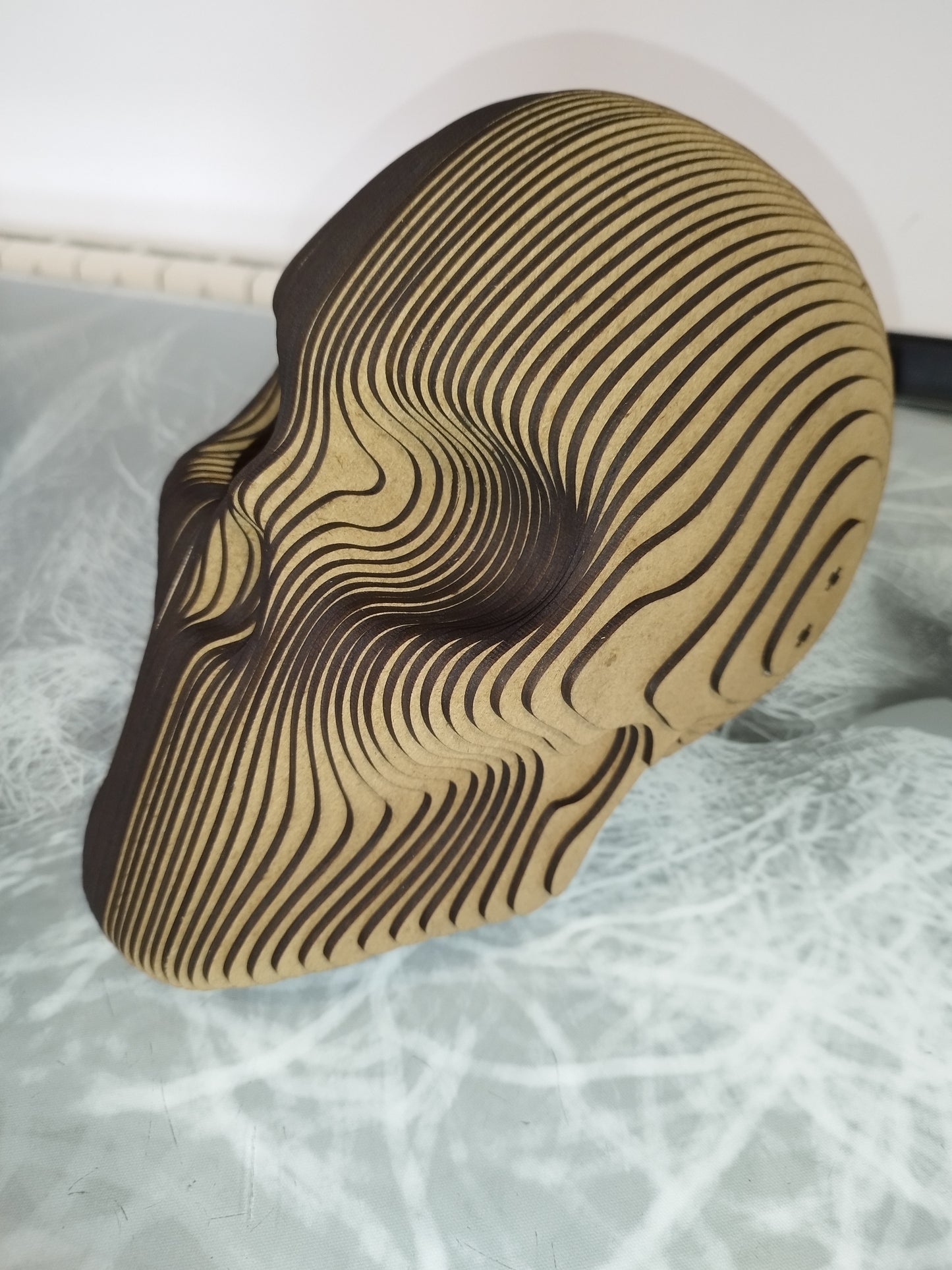 Cabeza de calavera laminada